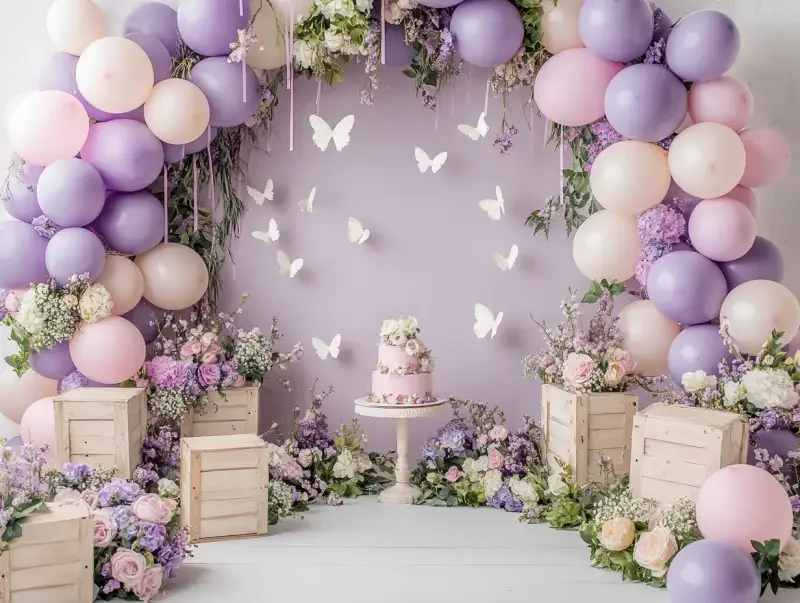 A backdrop composition featuring a purple and pastel pink colored balloon arch with small white butterflies on it, a cake smash aesthetic, lots of round balloon garlands over the wall, vintage wooden boxes full of flowers and greenery as decor props, a white floor, soft lighting, and a very luminous atmosphere. --v 6.1 --ar 4:3