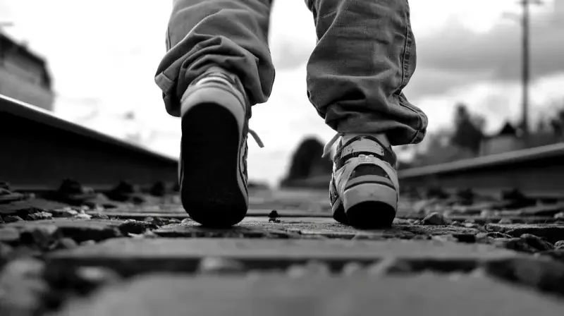 A pair of boys walking on the tracks, just a pair of feet! --v 6.1 --ar 16:9